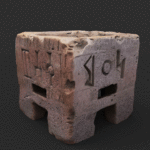 3D model render of a Sabaean pink‑limestone incense burner with four short legs, a square bowl, cross‑hatched decoration and a continuous Ancient South Arabian inscription on all sides, scaled to about 9.5 cm high and 10 cm wide.